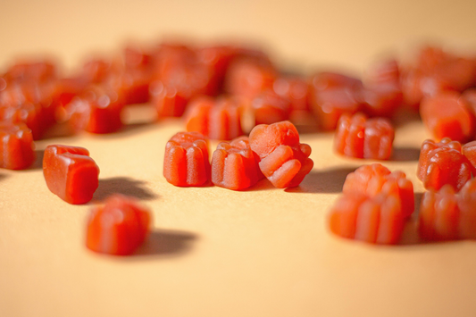 Collagen peptides supplements in gummy form accompanying an article about how collagen can cause constipation