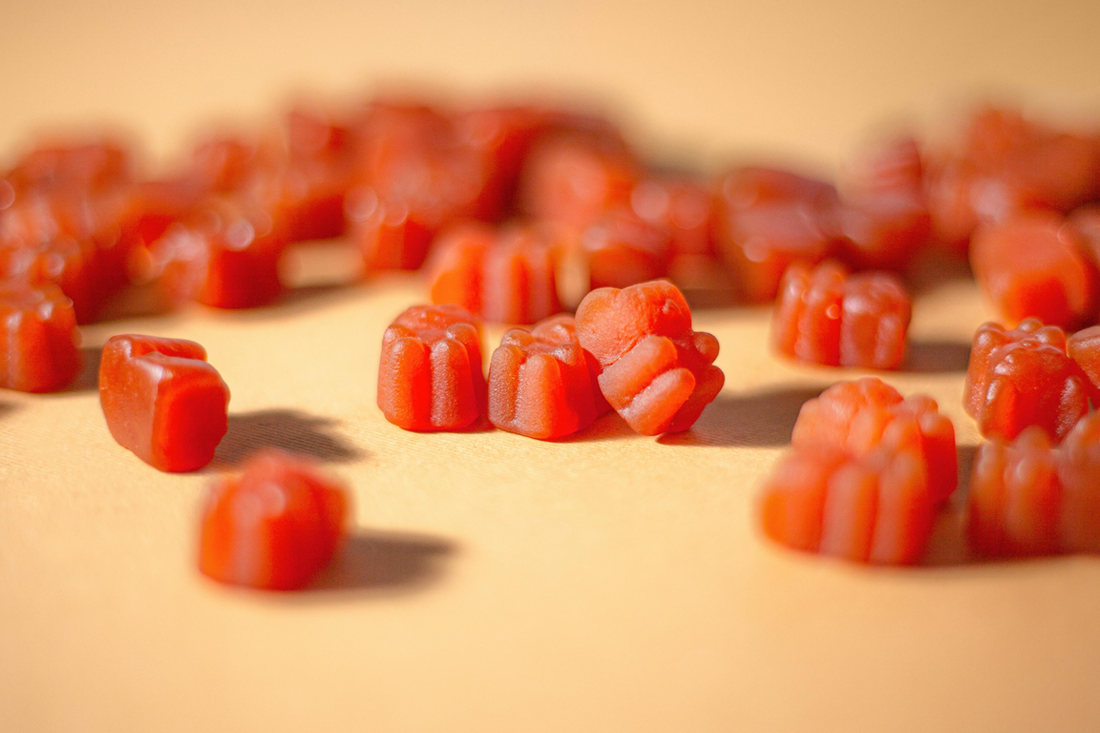 Collagen peptides supplements in gummy form accompanying an article about how collagen can cause constipation